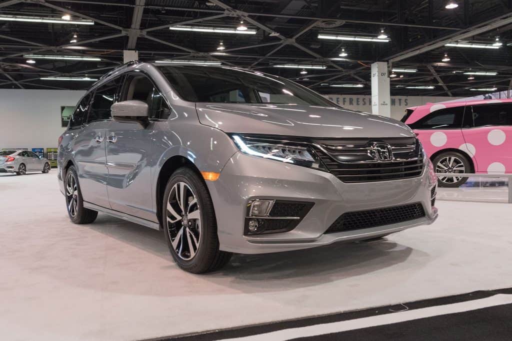A light gray Honda Odyssey displayed at the car show