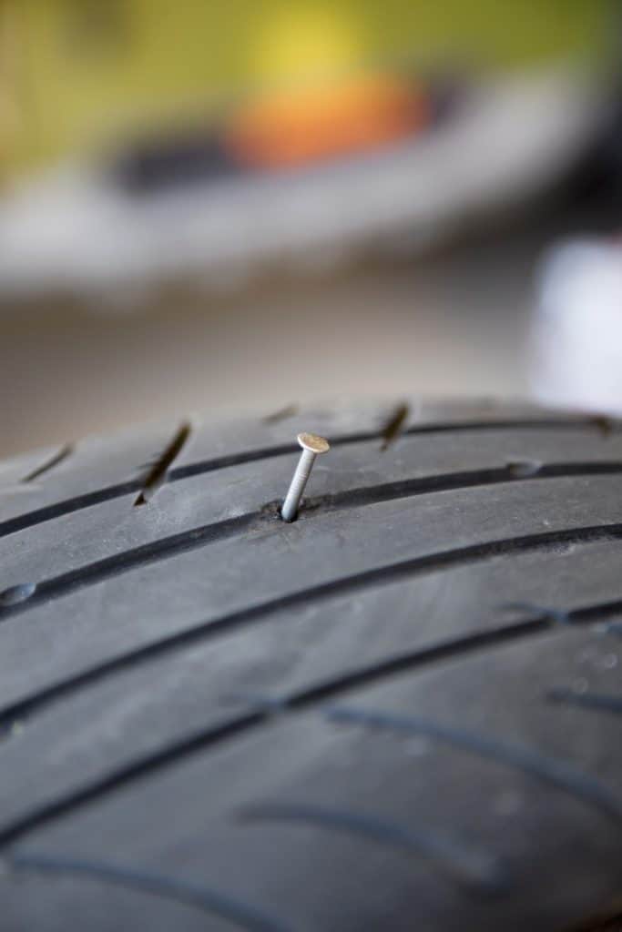 A nail puncture in a tire.