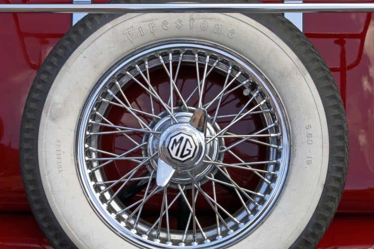 A spare tire manufactured by Firestone on the back of an old MG classic car, Do Firestone Tires Come With Rims?