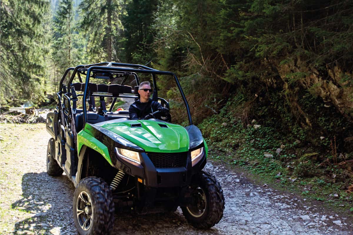 A tour group travels on ATVs and UTVs on the mountains. 11 Toy Haulers That Can Fit A Side By Side (UTV)
