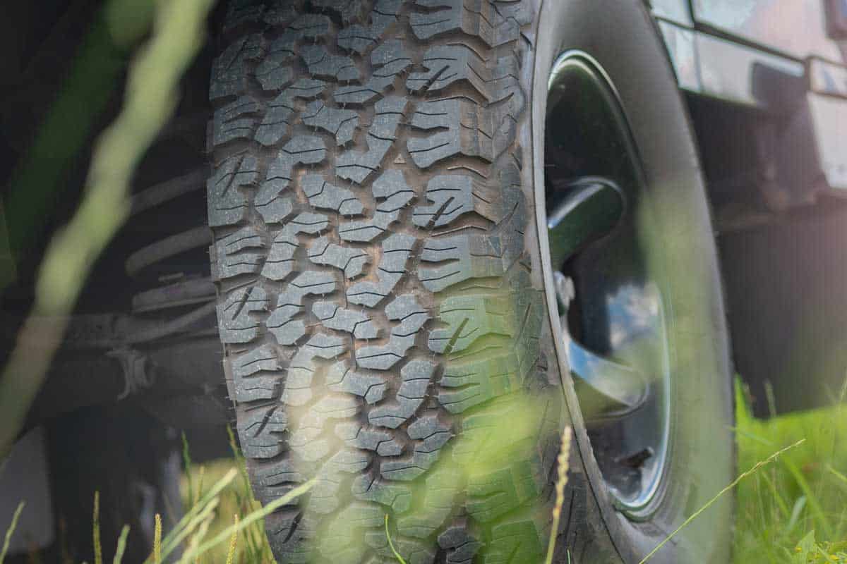 Bottom view of large off-road car wheel on grass landscape, How Long Should KO2 Tires Last?
