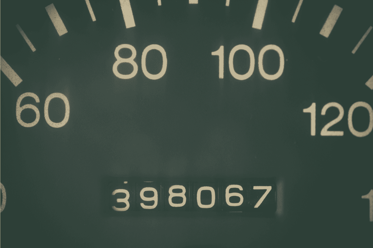 Car odometer showing a very high mileage.