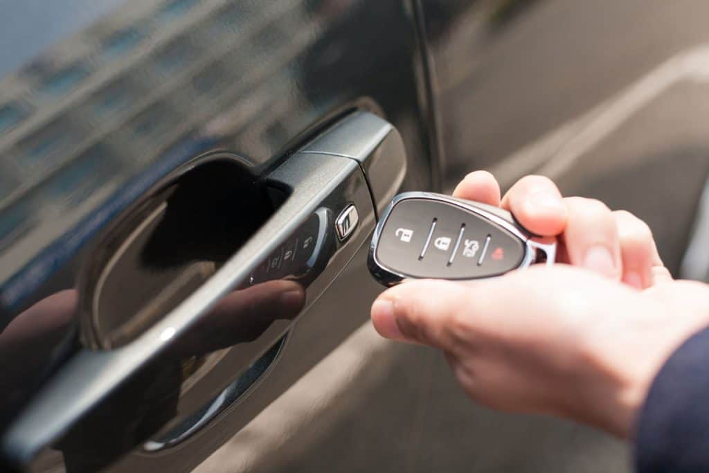 Close-up of male hand holding the car door/door for automotive/Car smart key