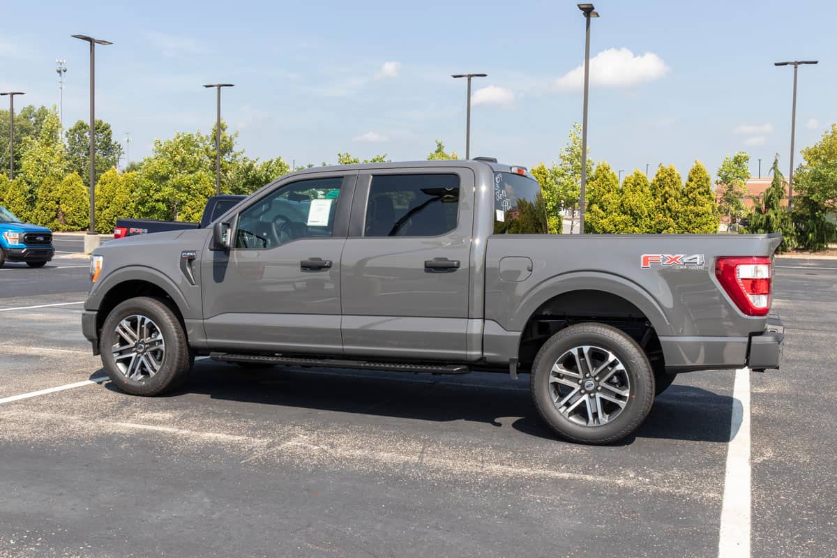 Dark gray Ford F150 parked in the spacious area