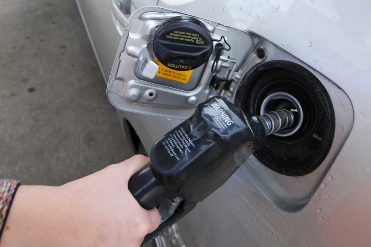 Filling the gas tank of a vehicle, What Are Fuel Tanks Made Of? [Everything You Need To Know!]