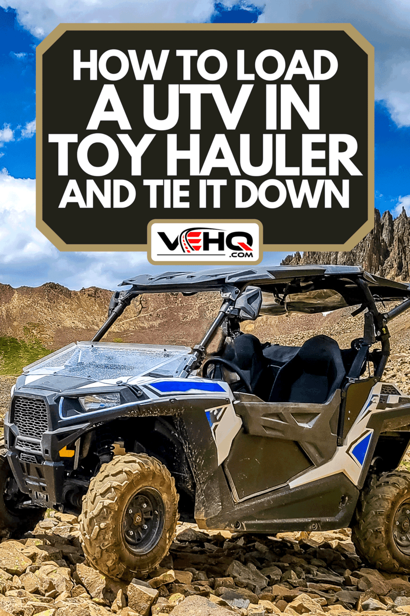 A 4x4 Side-by-Side off-road vehicle with a beautiful mountain range background, How To Load A UTV in Toy Hauler And Tie It Down
