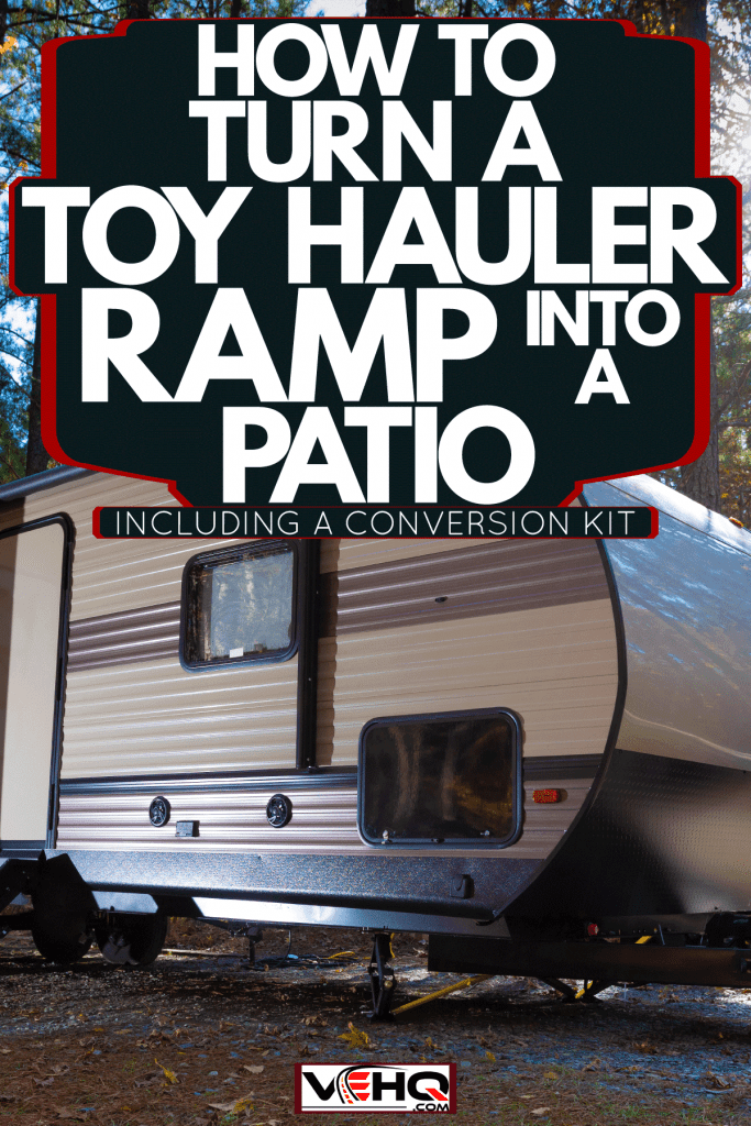 A travel trailer set up in a forestry area, How To Turn A Toy Hauler Ramp Into A Patio [Inc. A Conversion Kit]