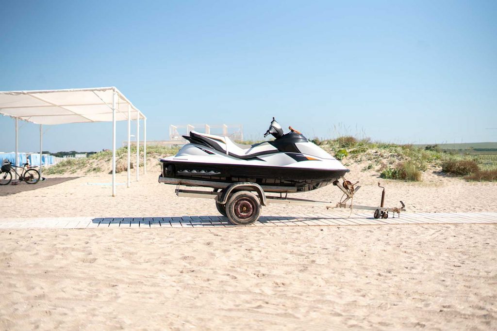 Jetski sport water bike on the trailer on the sandy beach