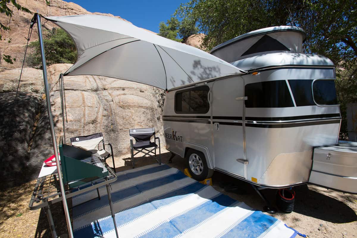 Meerkat tiny camper is setup with awning