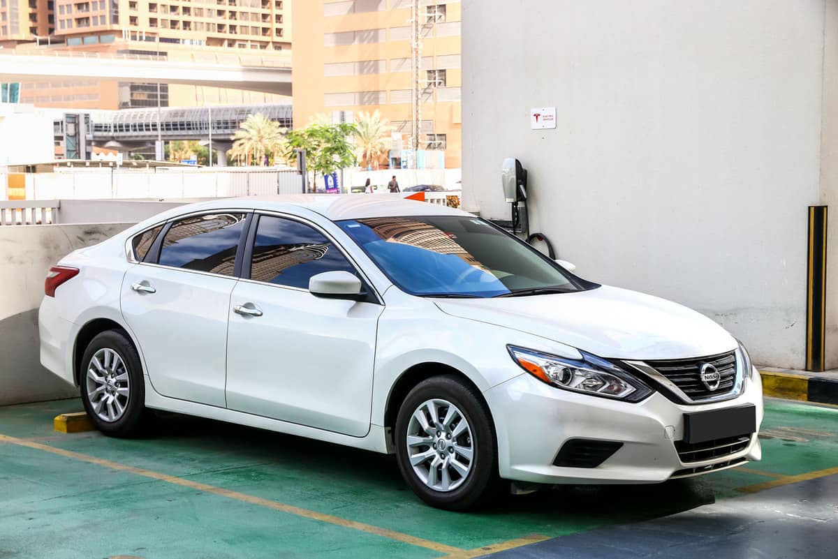 Motor car Nissan Altima in the city street., Does A Nissan Altima Have Remote Start?