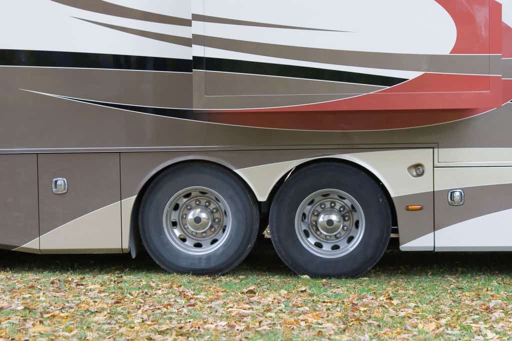 Motorhome parked in campground, Should RV Trailer Tires Be Balanced And Rotated?