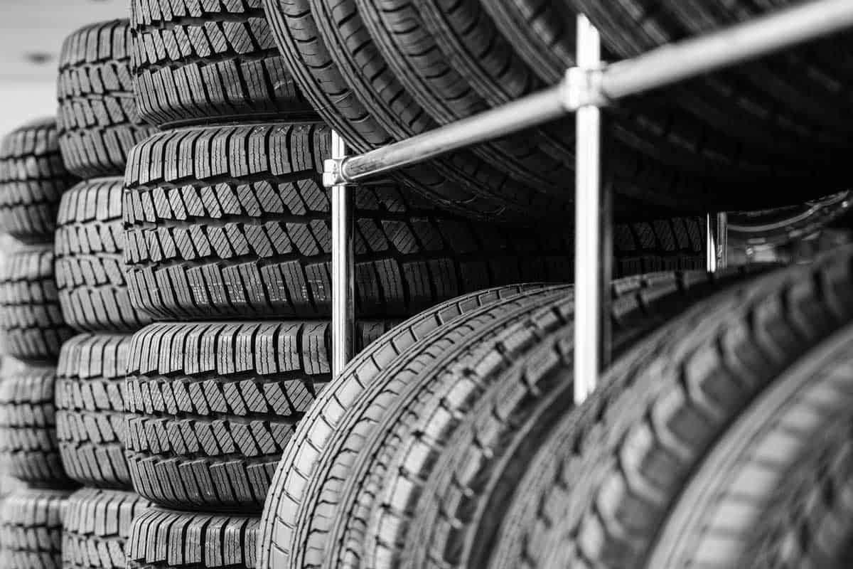 Rack with variety of new car tires in automobile store, How Wide Are Tires On Average? [By Type Of Vehicle]