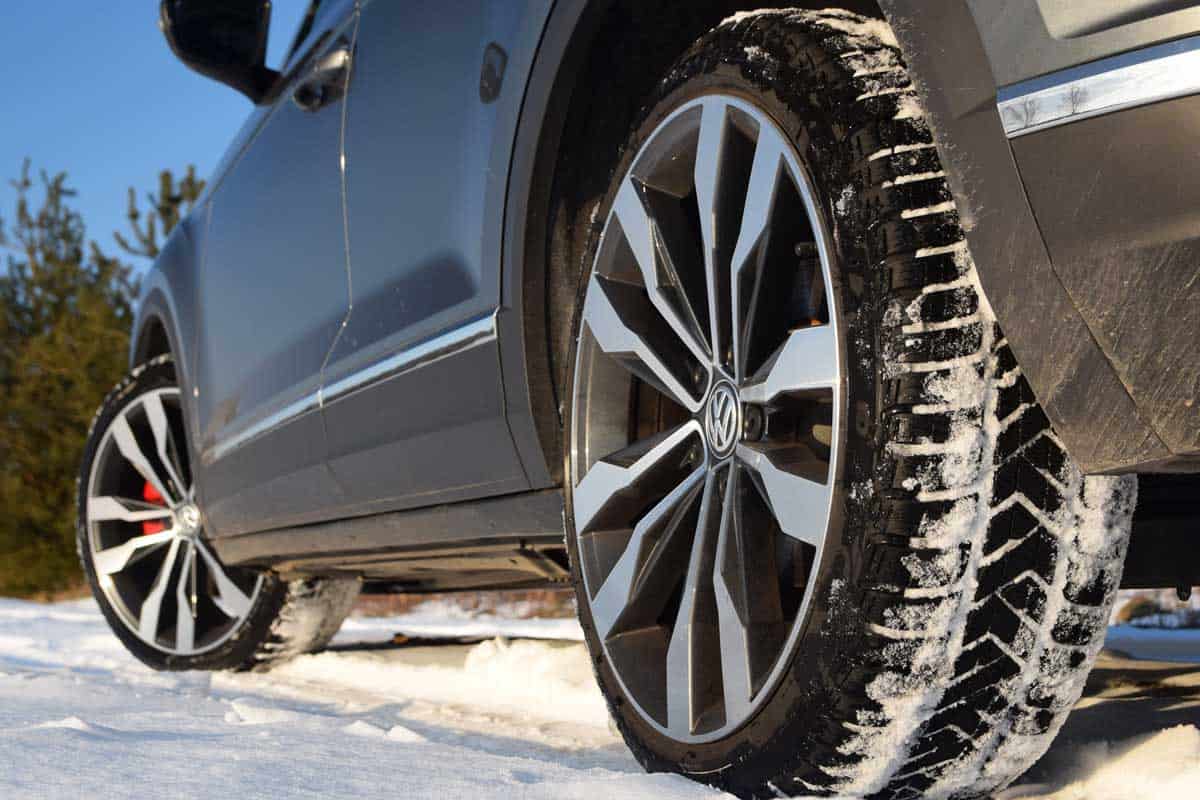 Winter tires in modern car on the snowy road, Do All 4 Tires Need To Be The Same Brand? Or Can You Mix And Match?