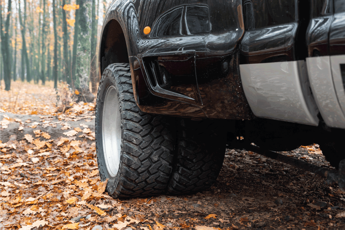 dual twin offroad performance wheel of super heavy duty pickup truck car at autumn forest