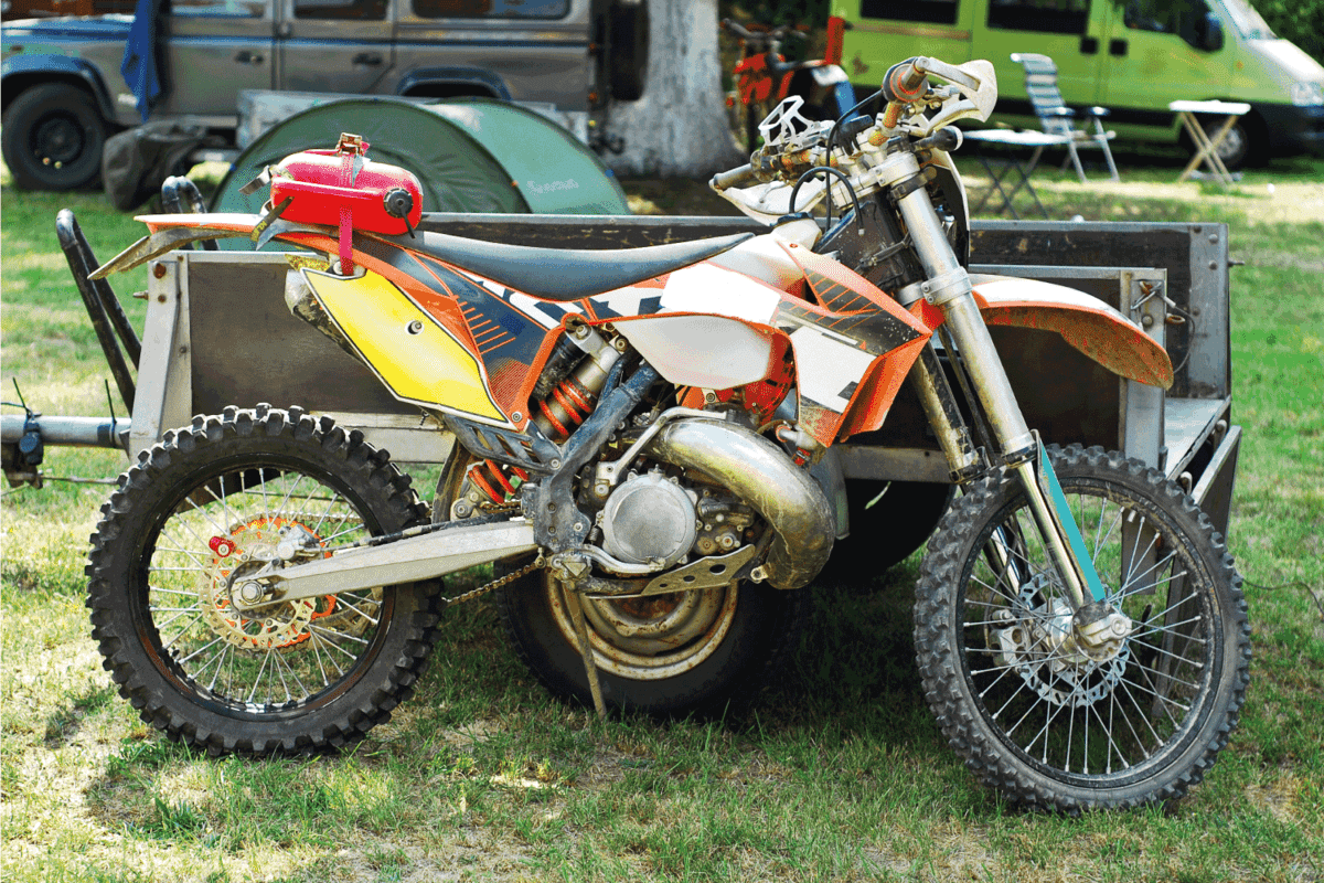motorcross bike with knobby tires and gas can on the seat