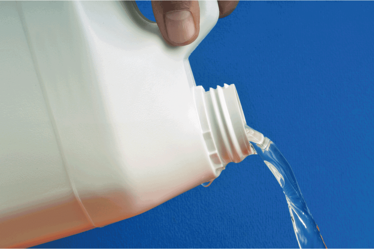 pouring bleach from a white sealed container