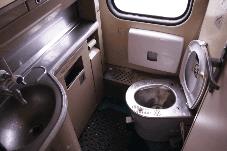 toilet interior with stainless steel finishings. Why Does My RV Toilet Stink [And What To Do About It]