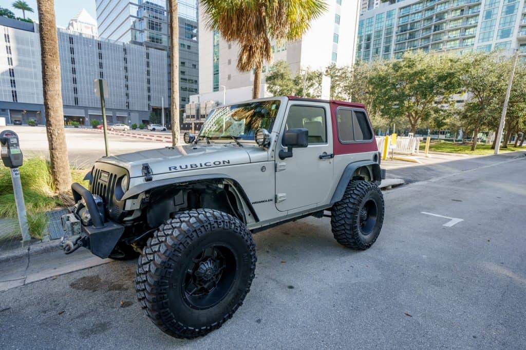 wo door Jeep Wrangler Rubicon lifted with oversized tires for trail riding 4x4