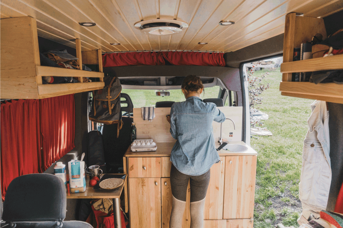 woman cooking pancakes in camper van. 11 Of The Best 5th Wheel Toy Haulers For Full-Time Living