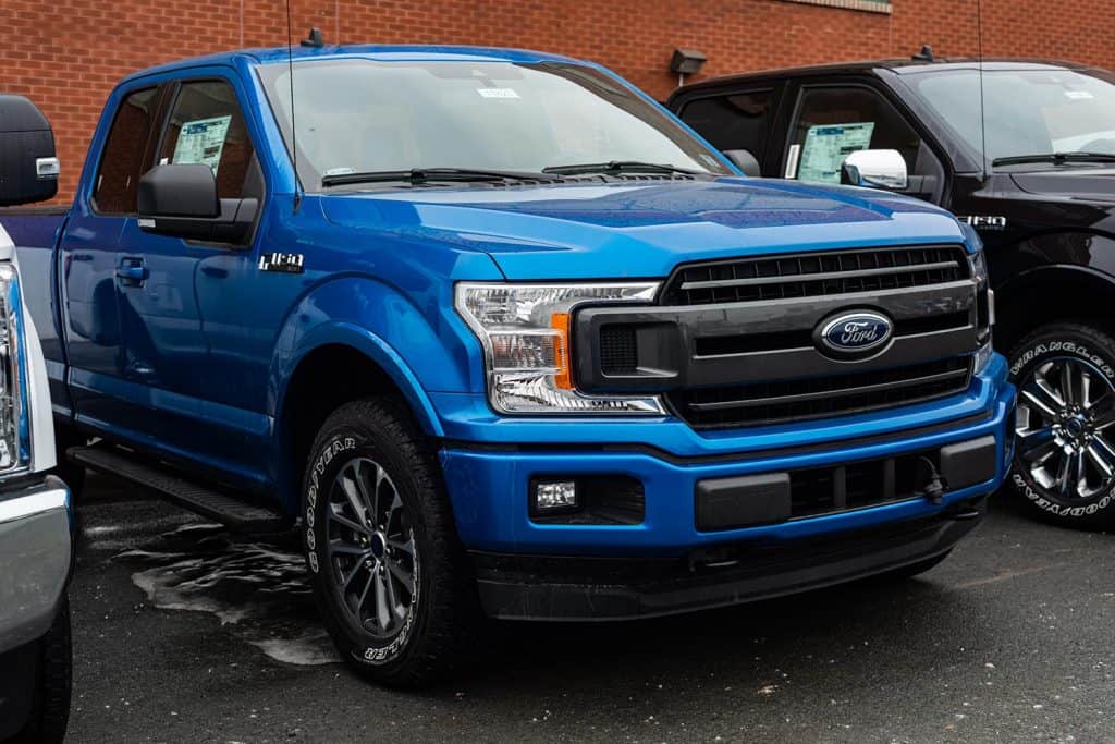 2020 blue Ford F-150 pickup truck on a parking lot