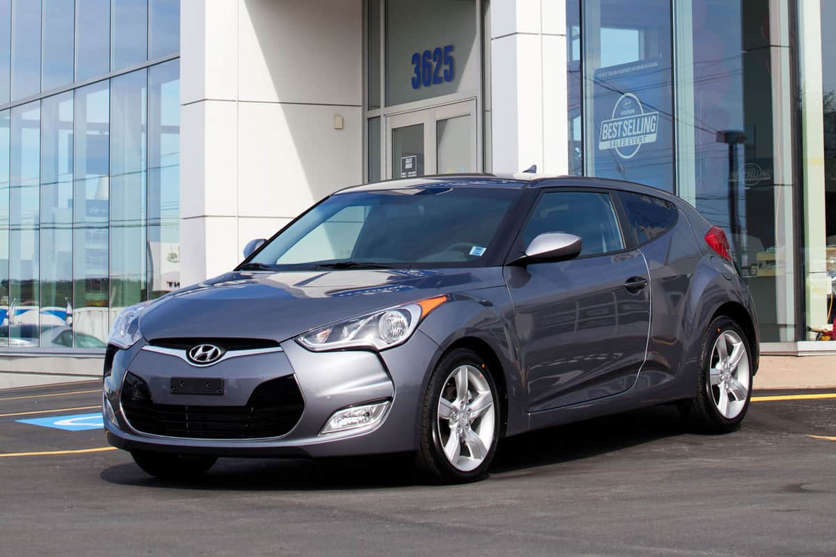 A Hyundai Veloster on a car dealership lot, Does A Hyundai Veloster Have A Spare Tire?