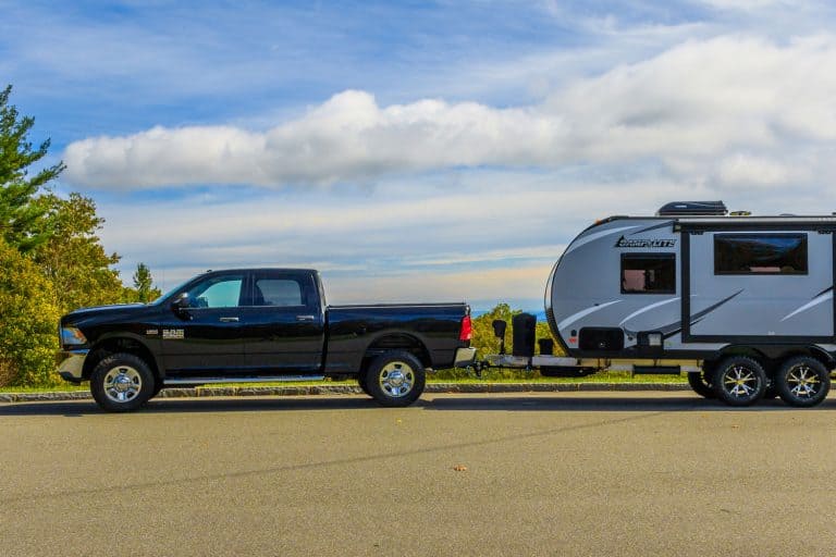 A Ram 2500 pickup towing a Camplite 16DBS travel trailer at an overlook on the Blue Ridge Parkway, Do You Need A Diesel Truck To Pull A 5th Wheel [Including 5th Wheel & Pick-up Models]]