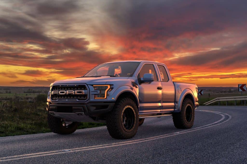 A beautiful gray colored Ford F-150 raptor photographed at golden hour