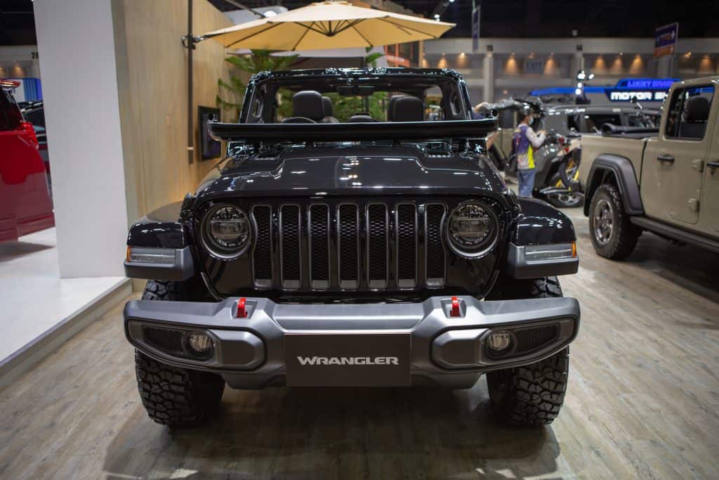 A black colored Jeep Wrangler displayed at a car show