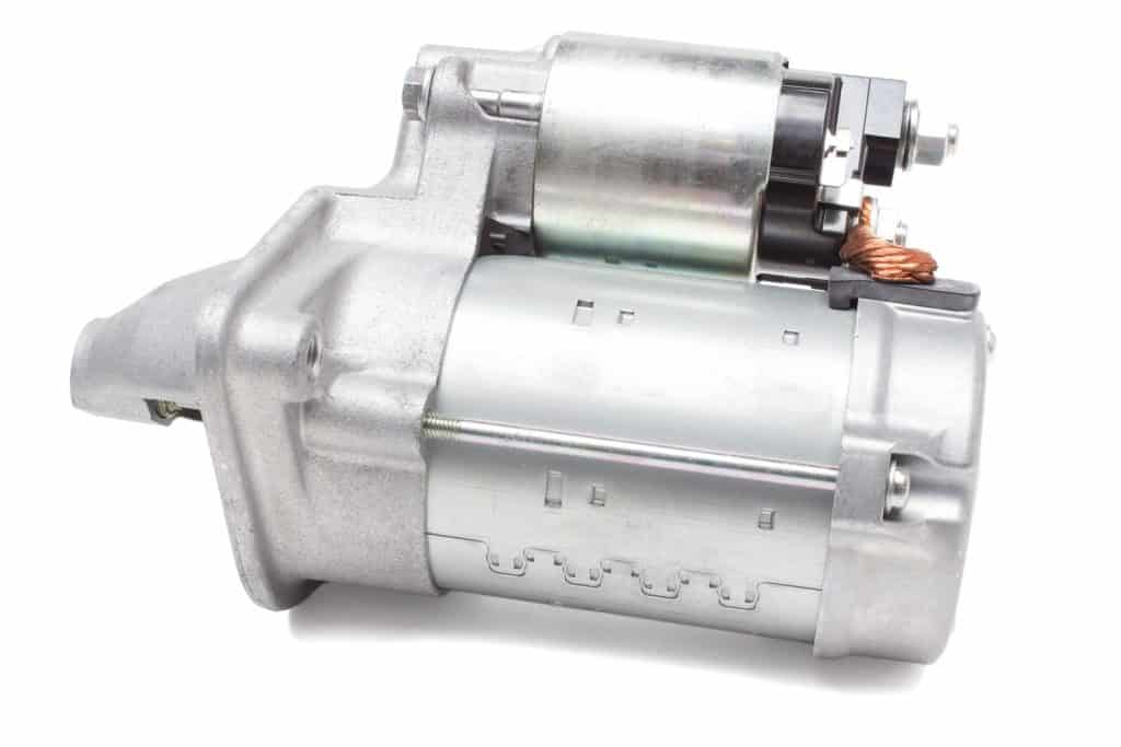 A car motor starter photographed on a white background