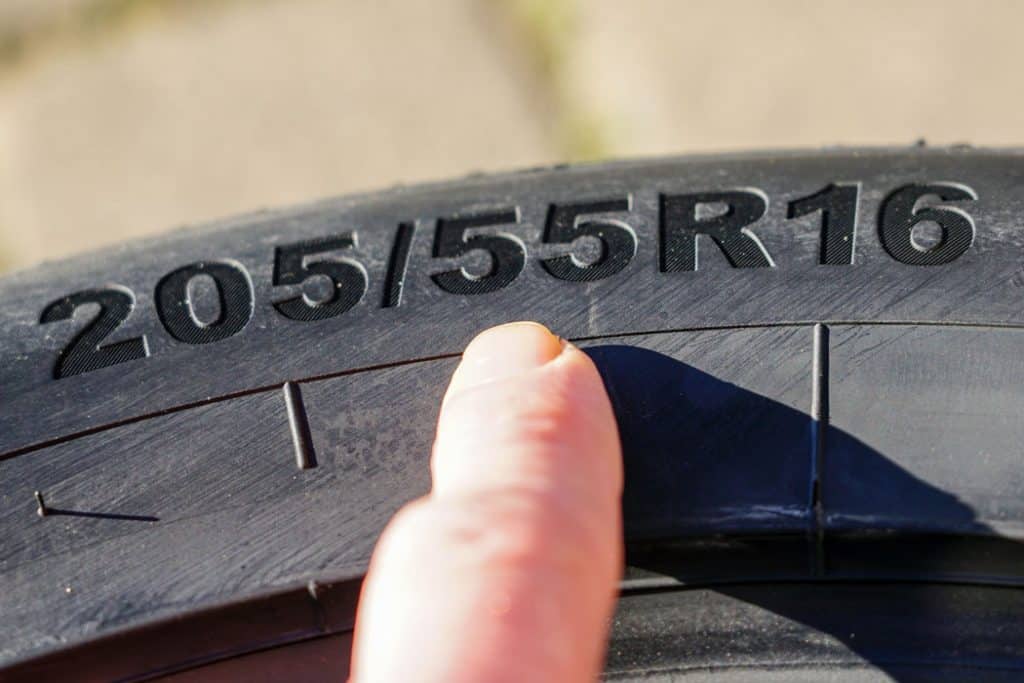 A car tire description and specification embedded on the side of the tire