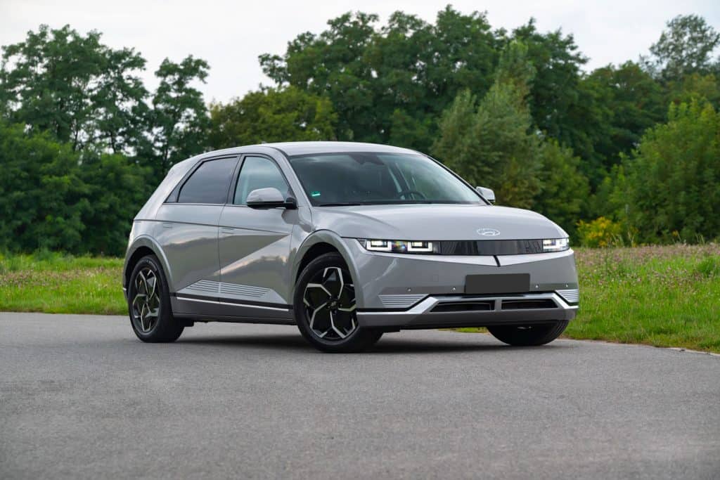 A futuristic looking gray colored Hyundai Ioniq photographed at the side of the road