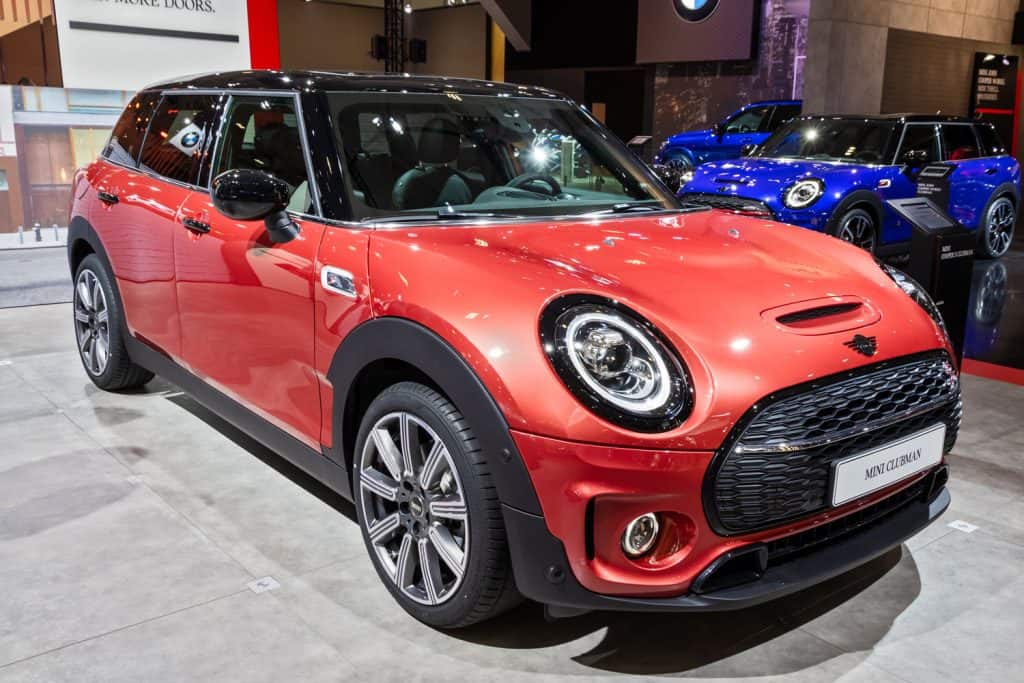 A light red colored Mini Clubman at a car display