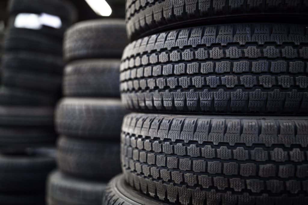 A stockpile of used tires in the junkyard