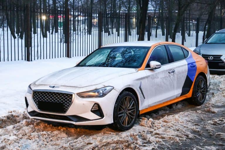 A white Genesis G70 on the side of a snowy road, Does The Genesis G70 Have A Spare Tire?