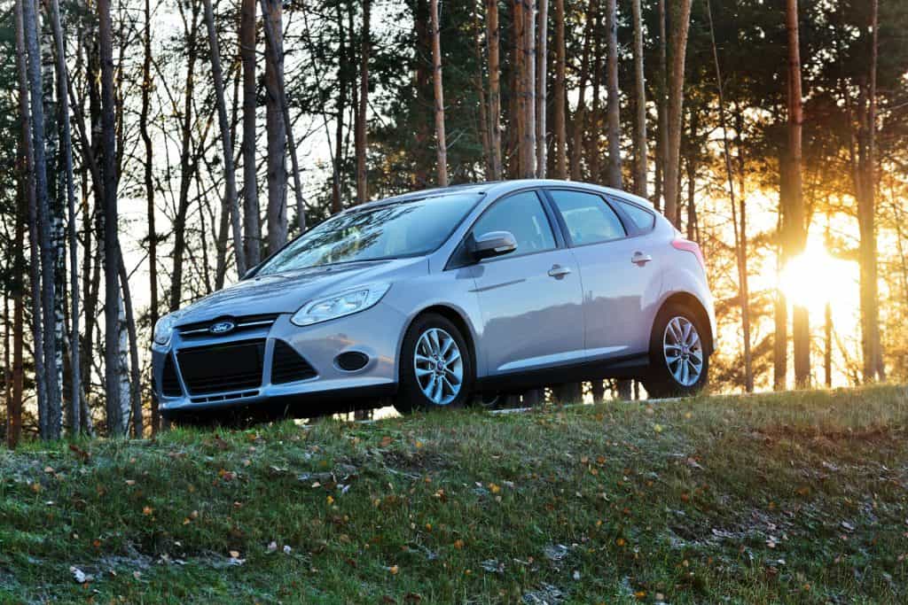 A white colored Ford Focus photographed near a forest, Can You Flat Tow A Ford Focus?