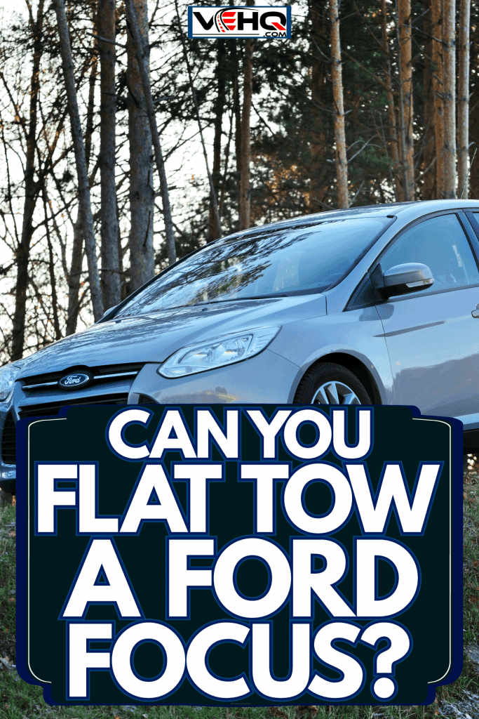 A white colored Ford Focus photographed near a forest, Can You Flat Tow A Ford Focus?