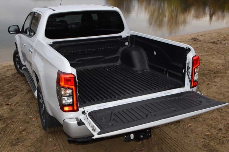 Cargo bed in Mitsubishi pick-up truck, How Much Bed Liner Does It Take To Paint A Truck? [Plus 3 of the Best Liners]