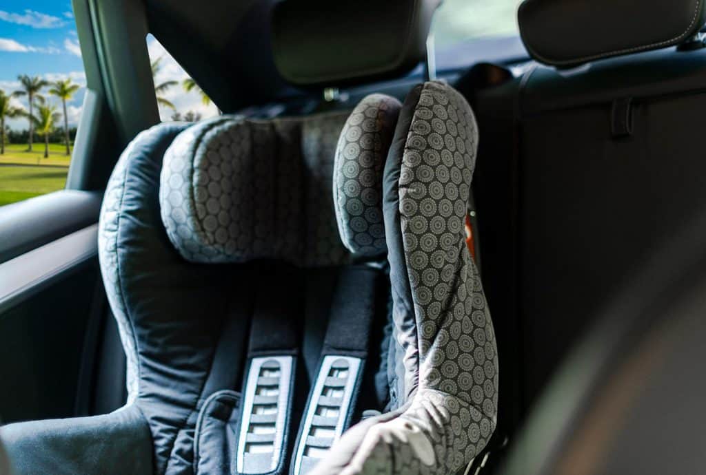 Child safety seat in the back of the car
