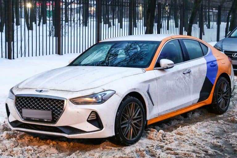 A compact executive sedan Genesis G70 in the city street, How Much Does A Genesis G70 Weigh?