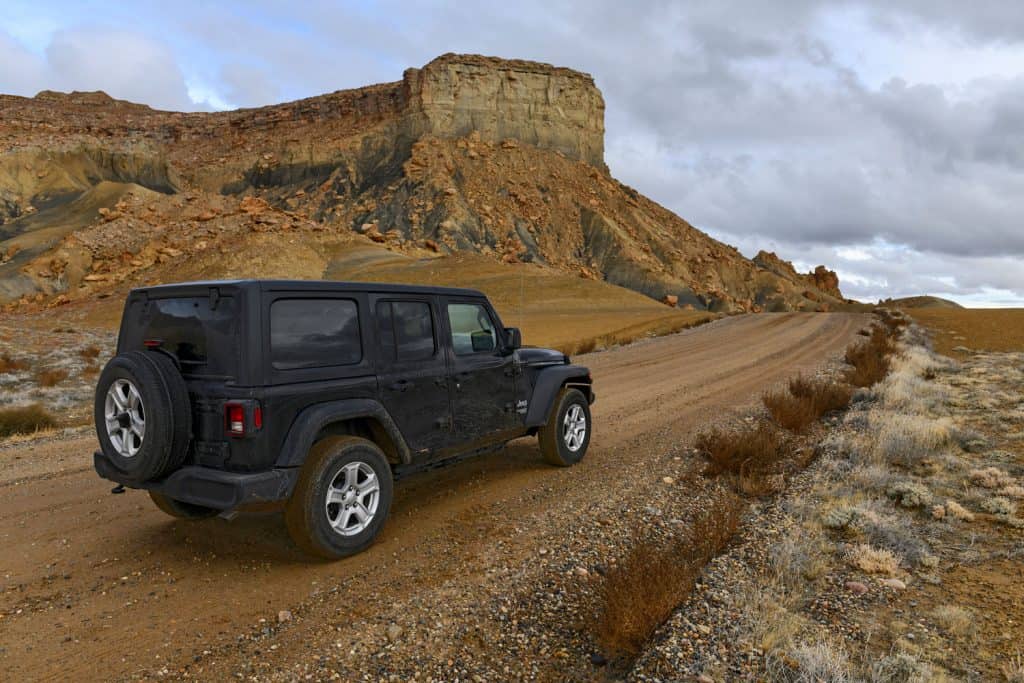Despite increase in outdoor tourism and recreation, many roads in the western U.S. are still unpaved and require four wheel drive vehicles such as the Jeep pictured