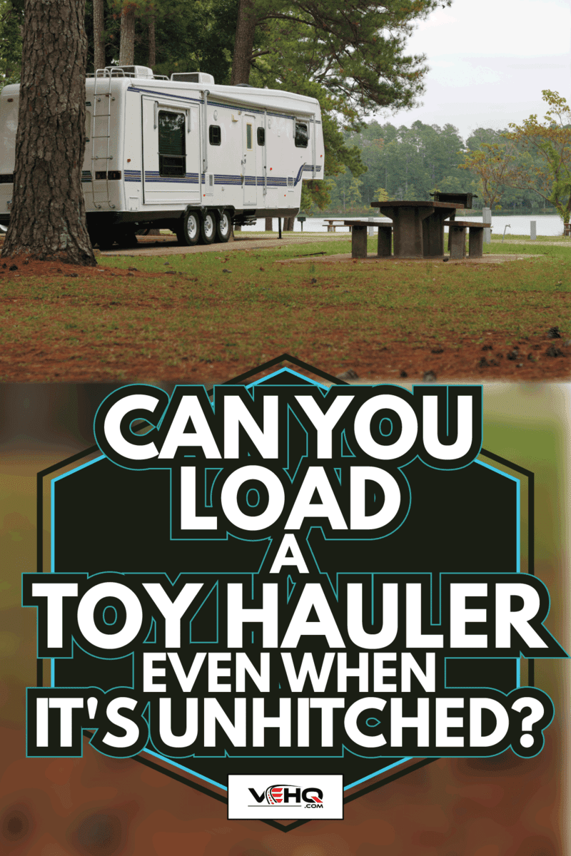 Fifth wheel camper in campground by lake. Can You Load A Toy Hauler Even When It's Unhitched