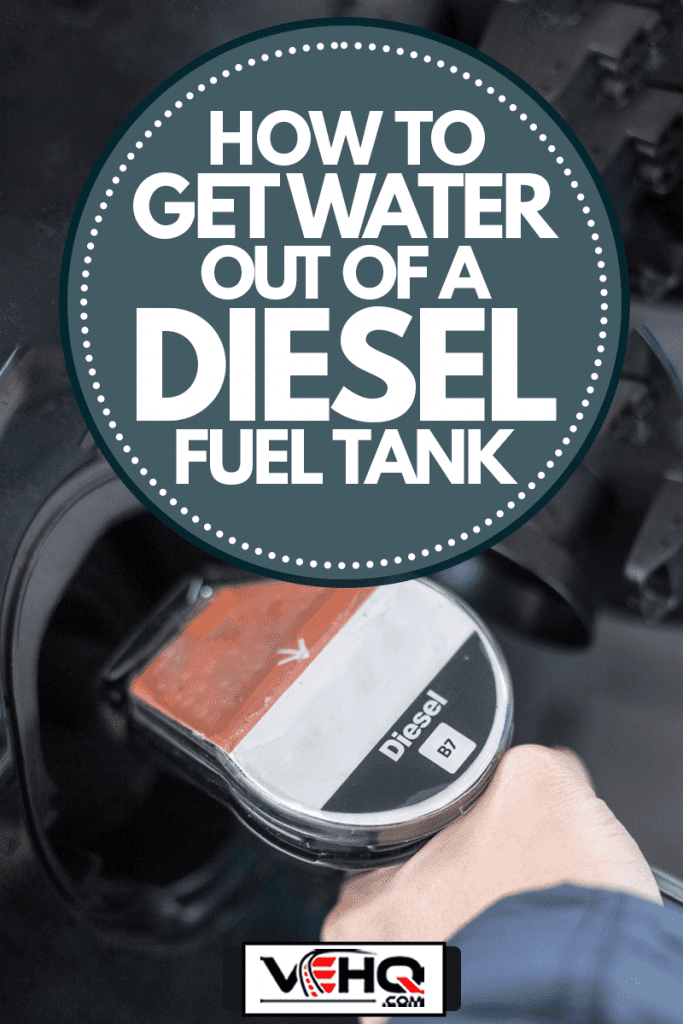Closeup of hand pumping diesel fuel into vehicle, How To Get Water Out Of A Diesel Fuel Tank