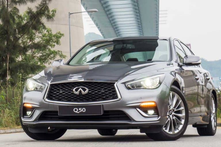 Infiniti Q50 on the main road for test drive, How Long Does The Infiniti Q50 Last? [In Miles And Years]