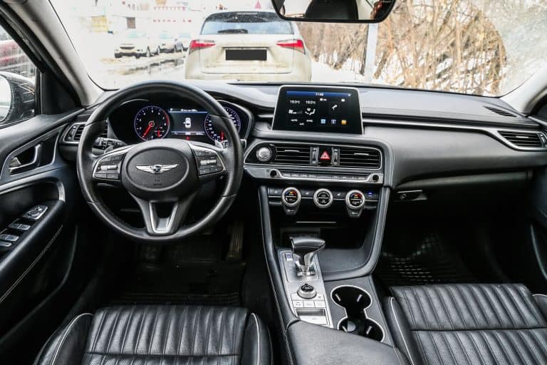 Interior of a luxurious leather dashboard of a Genesis G70, How To Change Clock Times On A Genesis G70