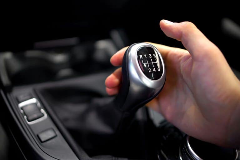 Male hand holding manual gearbox in car, test drive of new automobile, Hyundai Veloster Won't Go Into Gear—What Could Be Wrong?