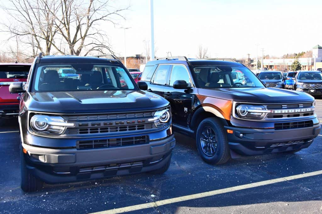 The front of the new 2021 Ford Bronco Sport vehicles begin to arrive at dealerships. A Shadow Black and a dark brown color four doors are shown.
