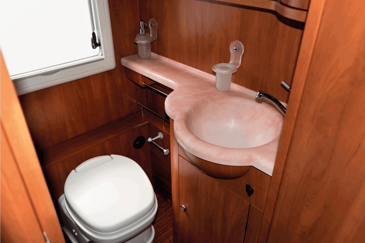 camper van RV bathroom with wooden accents