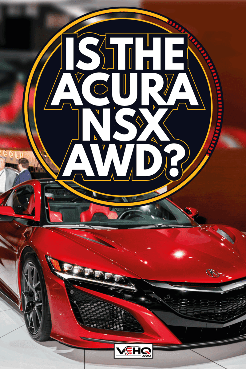 gleaming red Acura NSX under the spotlight in a international motor show. Is The Acura NSX AWD