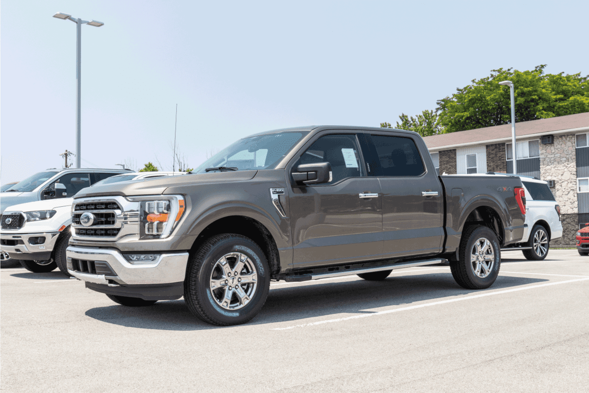 gray ford F150 with Ecoboost v6 parked on the dealership lot