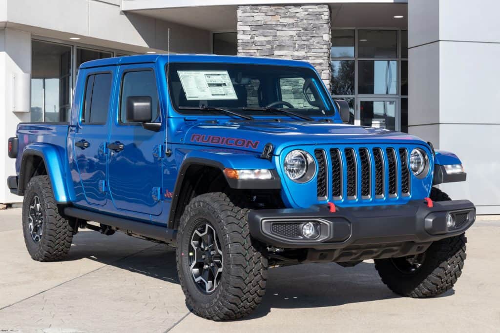A blue Jeep Gladiator displayed at a dealership